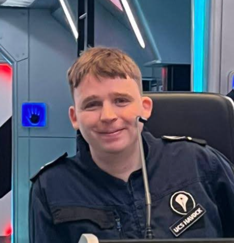 A photo of David Powell on a spaceship